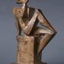BRONZE PATENTED SCULPTURE.
FEMALE FIGURE SITTING WRITING THE HORIZON IN THE WAITING OF THE FUTURE