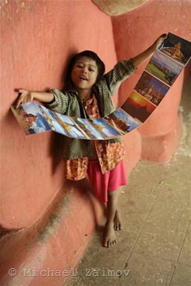 Burmese Child With Postcards /Michael Zaimov/ thumb