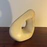 An abstract form carved from Maltese limestone. Infused within the stone are streaks of metals including iron, which add to the character and overall look of the piece. The finish is smooth.

My inspiration for this piece came from nature itself. I was walking along a beach when I picked up this ordinary rock...and the rest is history.