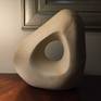 An abstract form carved from Maltese limestone. Infused within the stone are streaks of metals including iron, which add to the character and overall look of the piece. The finish is smooth.

My inspiration for this piece came from nature itself. I was walking along a beach when I picked up this ordinary rock...and the rest is history.