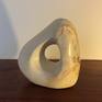 An abstract form carved from Maltese limestone. Infused within the stone are streaks of metals including iron, which add to the character and overall look of the piece. The finish is smooth.

My inspiration for this piece came from nature itself. I was walking along a beach when I picked up this ordinary rock...and the rest is history.