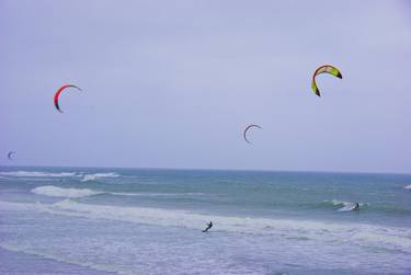 Kitesurfers Riding the Waves thumb