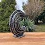Forged swirl of raw energy