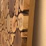 The mosaic is made from eight species of wood with most interesting color and structure so, that the underlying material was visible as few as possible. The pieces are individually bonded to the raw chipboard plate. Edge of the carrier board is plastered with the oak molding. The whole picture is dimly painted several times.