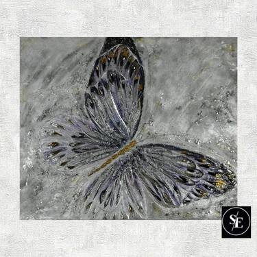 Large butterfly on a canvas of glass, mirrors and semi-precious stones on a gray background thumb