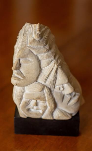 Composition with faces in stone thumb