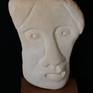 Sculpture in stone ( sea shingle ) on a wooden base.
Inspired from the ancient drama.
Prototype, one piece only.