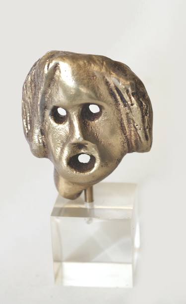 Mask in brass thumb