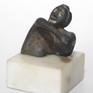 A micro sculpture of an upper body in a position of despair.

Inspired from the ancient drama.

Βronze figurine made by wax method with patina on a marble base.