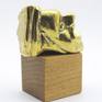 A micro sculpture in brass with gold patina on a wooden base.
Inspired from the ancient Greek drama.