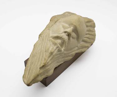 Head with beard in stone thumb