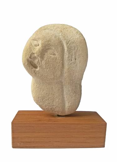 Girl's head in stone thumb