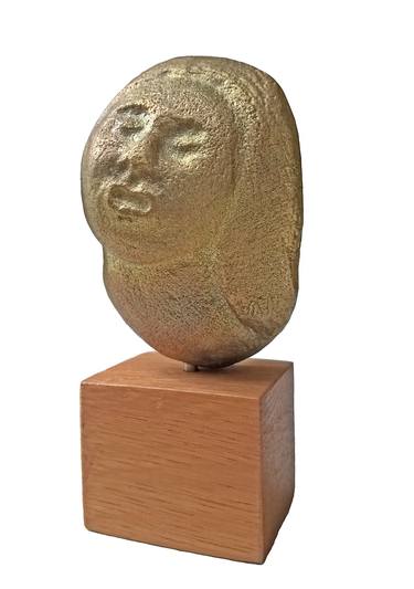 Woman's head in pressed brass thumb