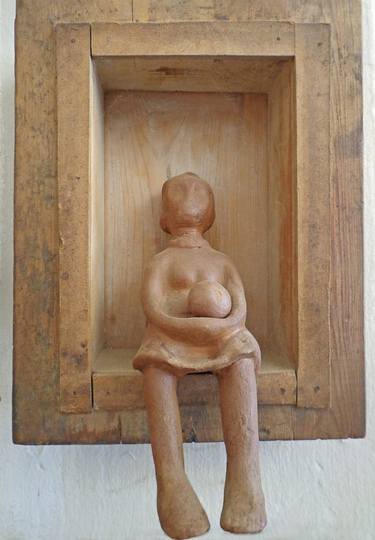 Girl with a ball on a wooden seat thumb