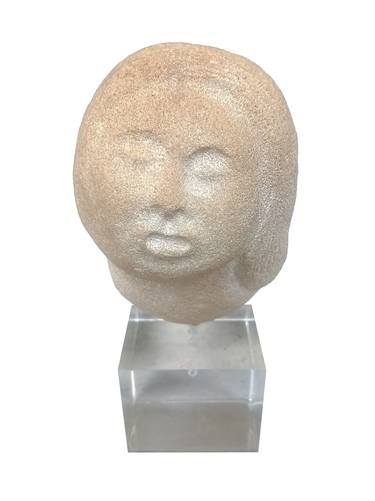 Woman's head in stone thumb