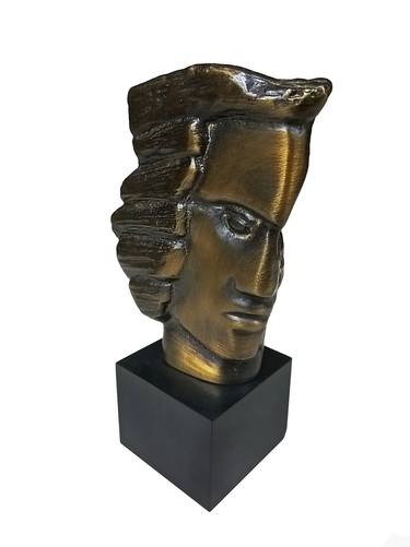 Young head in brass with patina thumb