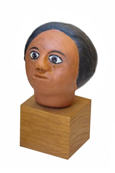Painted head in natural clay thumb