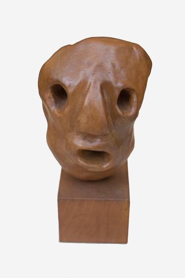 Two-sided mask in clay thumb
