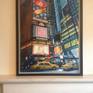 This is a large painting of Times Square, New York. It captures the dazzling lights of a night time scene where the advertising lights add to the excitement of the city. The yellow taxis symbolise the New York scene. I painted this after visiting New York and couldn't wait to start painting when I got back home. This painting is framed with a lovely black wooden frame which compliments the bright colours. It is a large statement piece ready to hang, pride of place, in your house.