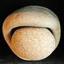 Unique sculpture made out of round stone and eroded base of a large ceramic vessel found during the mudlarking trip alongside foreshore of river Thames London.