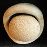 Unique sculpture made out of round stone and eroded base of a large ceramic vessel found during the mudlarking trip alongside foreshore of river Thames London.