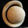 Unique sculpture made out of round stone and eroded base of a large ceramic vessel found during the mudlarking trip alongside foreshore of river Thames London.