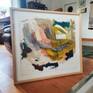 Framed under plexiglass