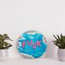 A painting from a series of artworks with balloons in the form of words.
This is a humorous statement that shows the thoughts of people who watch the news and gradually go crazy.
All they can do is swear.