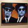 A painting of Dan Ackroyd and John Belushi as the Blues Brothers. The Blues Brothers movie was my first introduction to several legendary musicians, such as Ray Charles, Aretha Franklin, James Brown, and John Lee Hooker.
Painting comes in a black frame, ready to hang.
Painting also comes with a certificate of authenticity, signed by the artist.