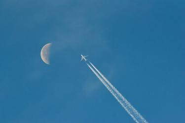 Daytime moon with airplane thumb