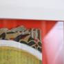 portrait oif a sceptic man, painted on cardboard, framed with bright orange background