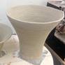 The vase in the first stage ; raw carved clay before first firing at 1080 degrees celsius