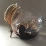 A collection of darkness and light trapped in a jar for safekeeping.