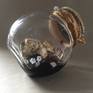 A collection of darkness and light trapped in a jar for safekeeping.