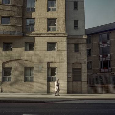 A street in London, a man, a shadow thumb