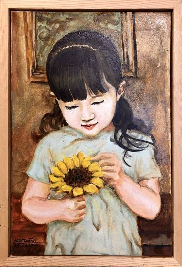 little girl and sunflower thumb