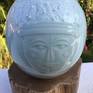 Handcrafted in porcelain with application of blue Celadon glaze. A unique piece of art, fired at 1300 degree C.

The art work comes with an  wooden base.