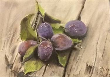 Blue plums in still life on a wooden table thumb