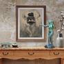 Centerpiece art above a sideboard w bronze figure