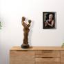 pastel painting of Eve with sculpture in bedroom