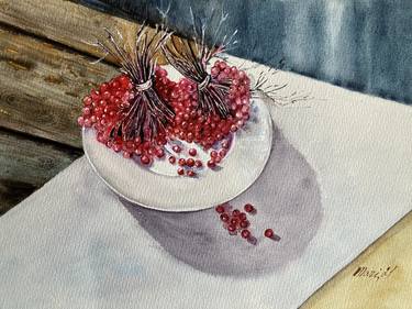 Red viburnum berries on a white dish. thumb