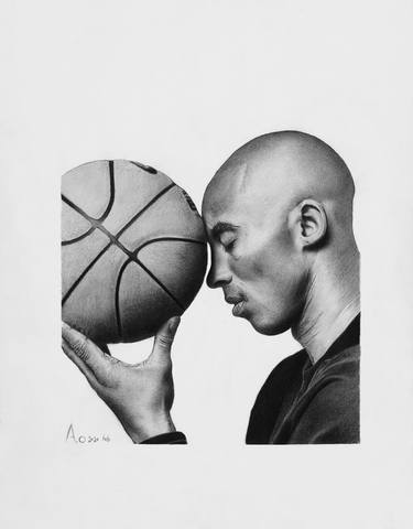 Kobe Bryant holding his basketball thumb