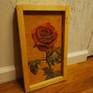This red rose was an oil painting I created in February as a series exploring roses and flowers through realism. I painted it on reclaimed plywood wood from my local carpentry school. This painting was to explore the curves and beauty within a rose.