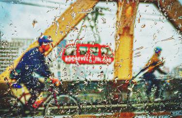 Bikers in Rain on Bridge With Tram thumb