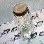 Mason jar on fish fabric by Paul Brandner