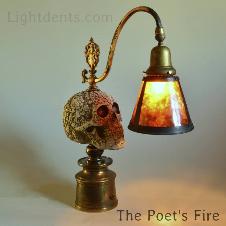 Accent lamp. Carved Skull, Amber Mica shade. Brass base.