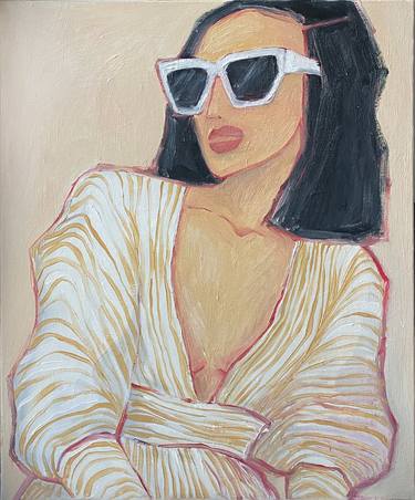 Portrait of a woman in sunglasses in beige tones. thumb