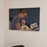 Young mother and her little child,reading the first book .
