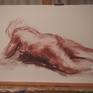 Nude study of a woman,lying on her stomatch, created in the studio.