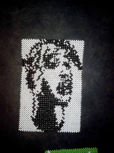 Beads representing tupac thumb